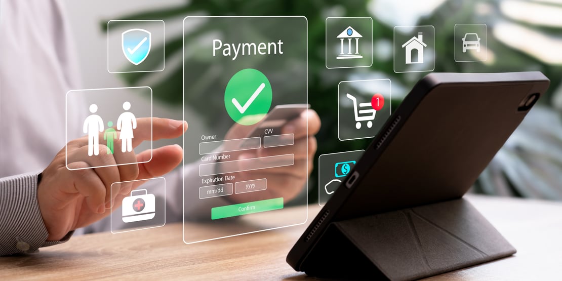 Person using a tablet to complete a secure digital payment, with virtual payment interface, card details form, and financial service icons displayed on screen.